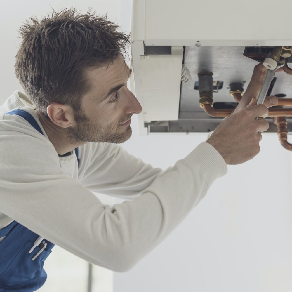 professional-plumber-checking-a-boiler.jpg